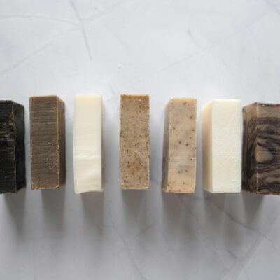 Collection of natural soaps placed on marble table